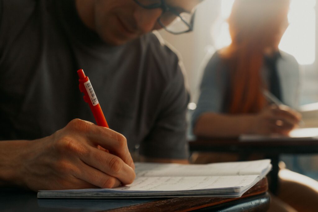 Focused students taking notes during a lecture at a university in Buenos Aires.